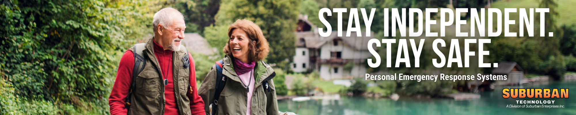 Elderly couple walking together in nature, promoting independence and safety with personal emergency response systems. Suburban Technology branding visible in the corner.